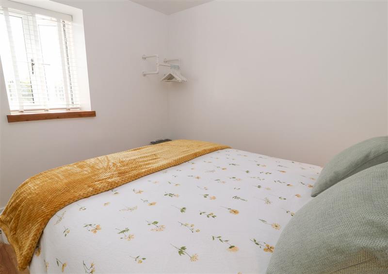 This is a bedroom at Pear Tree Cottage, St. Mellion near St Dominick