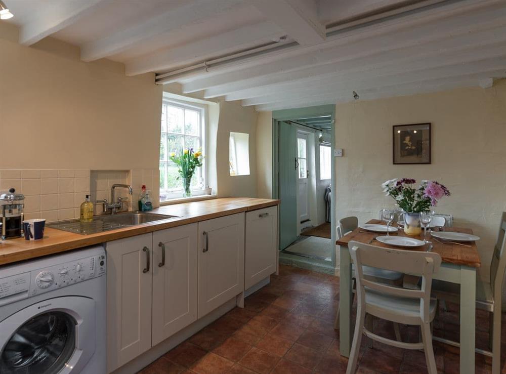 Well equipped kitchen with dining area at Pear Tree Cottage in Wenhaston, near Southwold, Suffolk