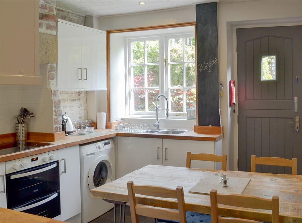 Quaint kitchen/ dining room at Pear Tree Cottage in Wirksworth, near Matlock, Derbyshire