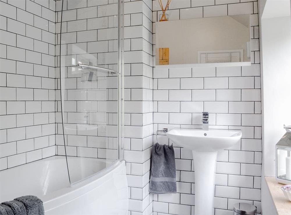 Well presented tiled bathroom at Pear Tree Cottage in Wirksworth, near Matlock, Derbyshire