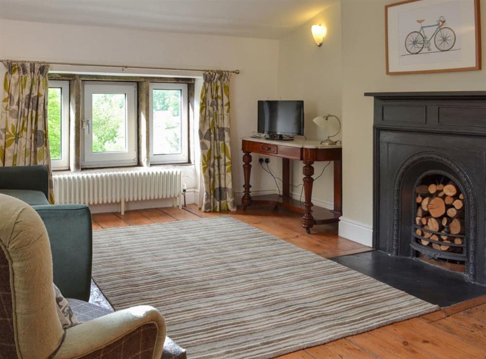 Spacious and warming living/dining room with open fireplace at Pear Tree House Annexe in Wooldale, near Holmfirth, Yorkshire, West Yorkshire