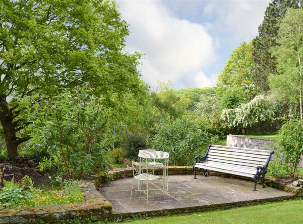 Verdant garden and grounds with seating area with wonderful views at Pear Tree House Annexe in Wooldale, near Holmfirth, Yorkshire, West Yorkshire