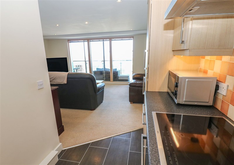 Relax in the living area (photo 2) at Pears Suite, Whitehaven