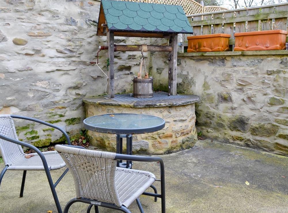 Enclosed courtyard with garden furniture at Peartree Cottage in Shildon, near Bishop Auckland, Durham