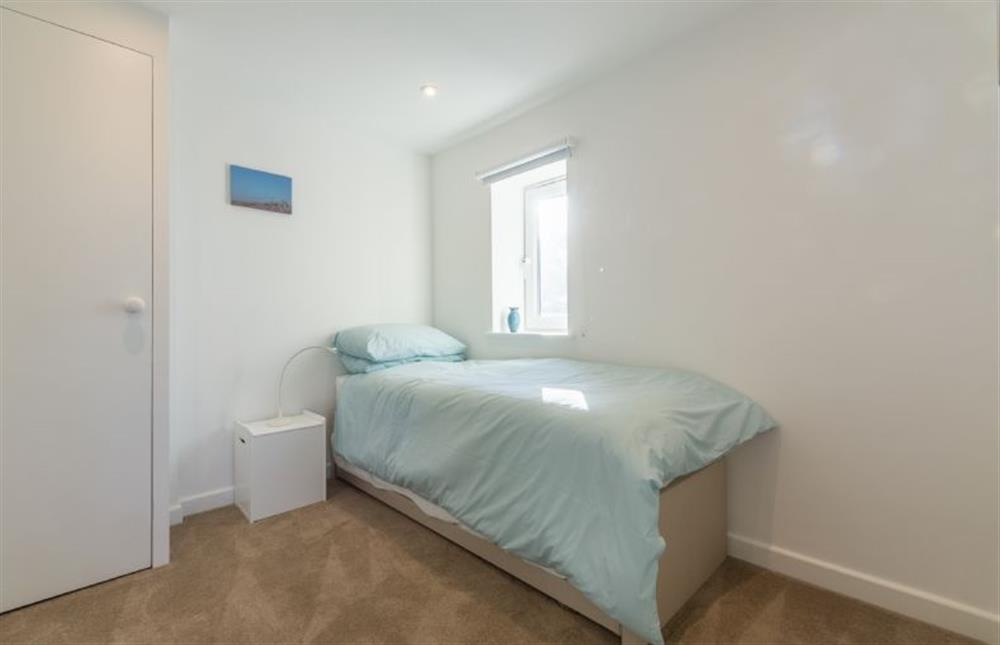 First floor: Bedroom three can be set up with single, twin or double bed at Pebble Cottage, Brancaster Staithe near Kings Lynn