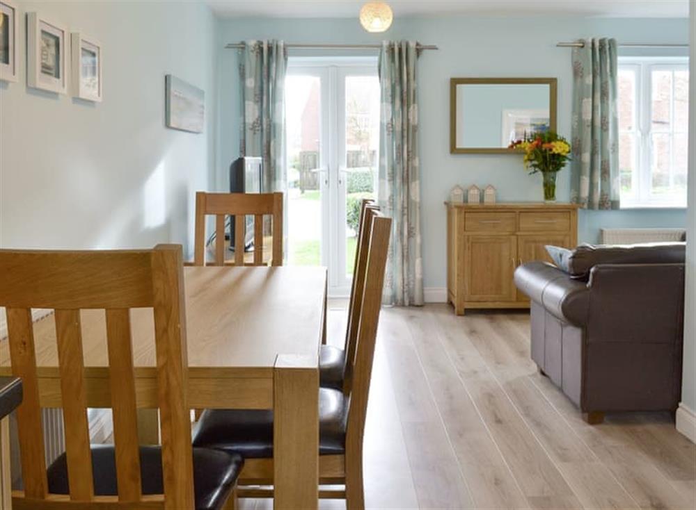 Living areas with French door to garden at Pebble Cottage in Near Filey, North Yorkshire