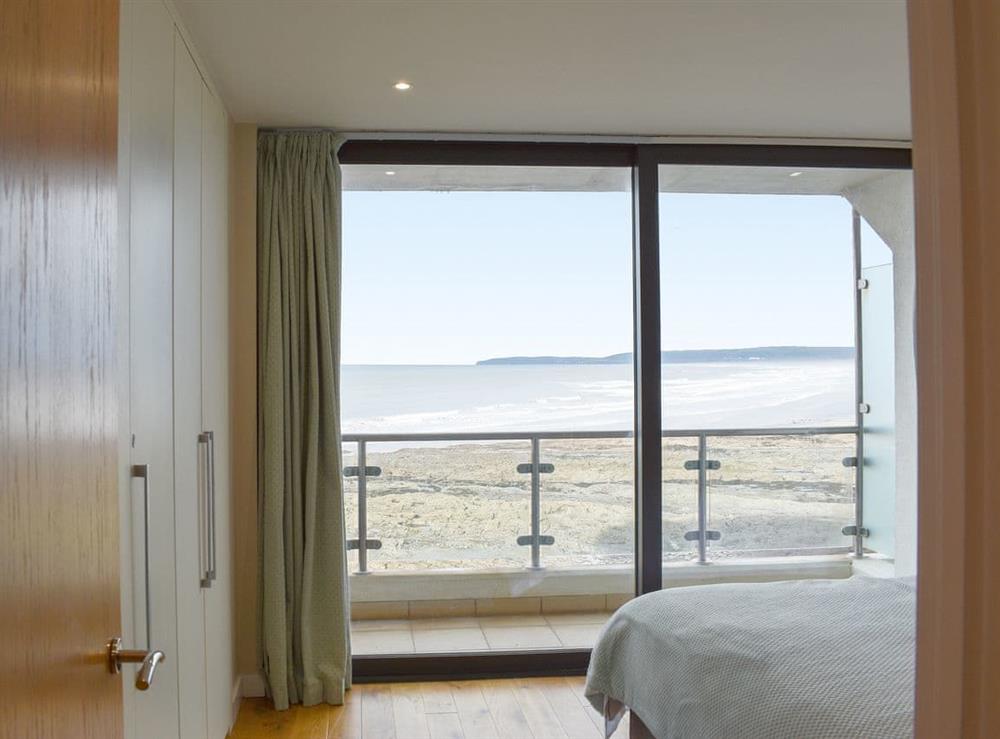 Double bedroom with sea views at Pebbles, Horizon View in Westward Ho!, Devon