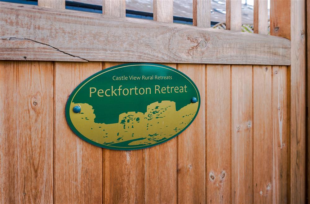 Signage on the gate to Peckforton Retreat, Beeston, Cheshire