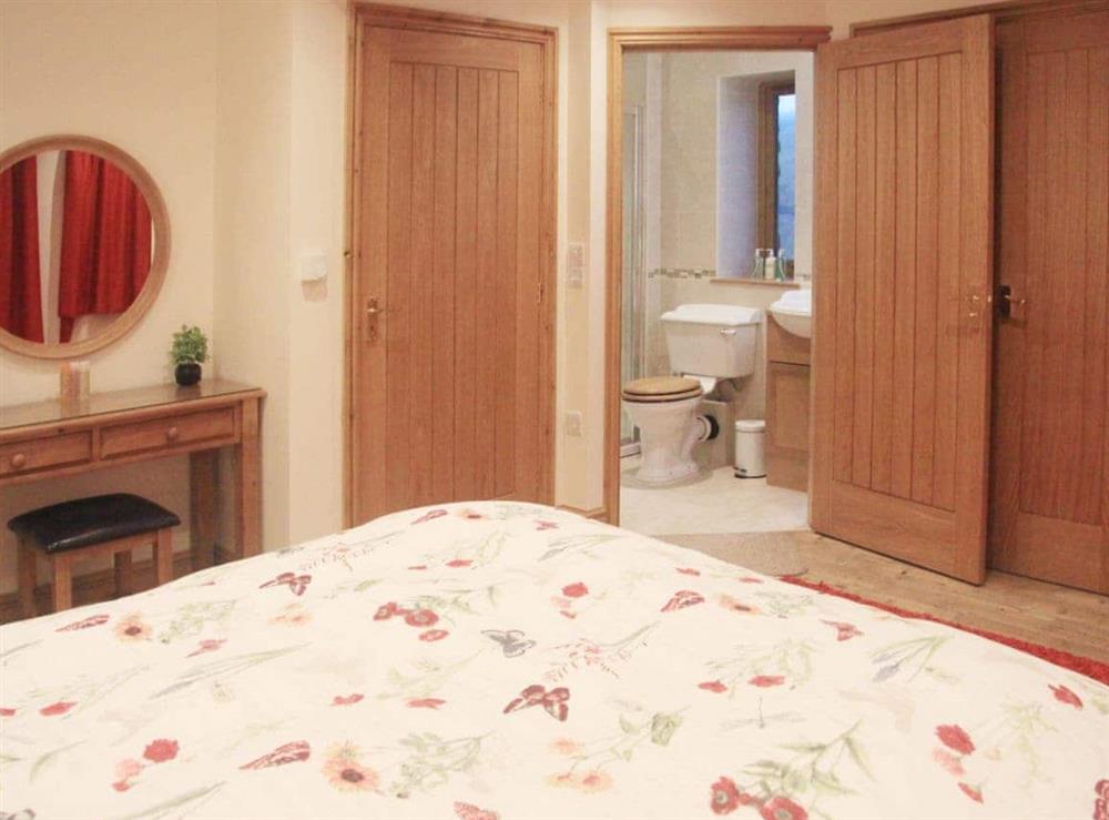 Stylish double bedroom with en-suite shower room at Peggys Barn in Mallerstang, near Kirkby Stephen, Cumbria