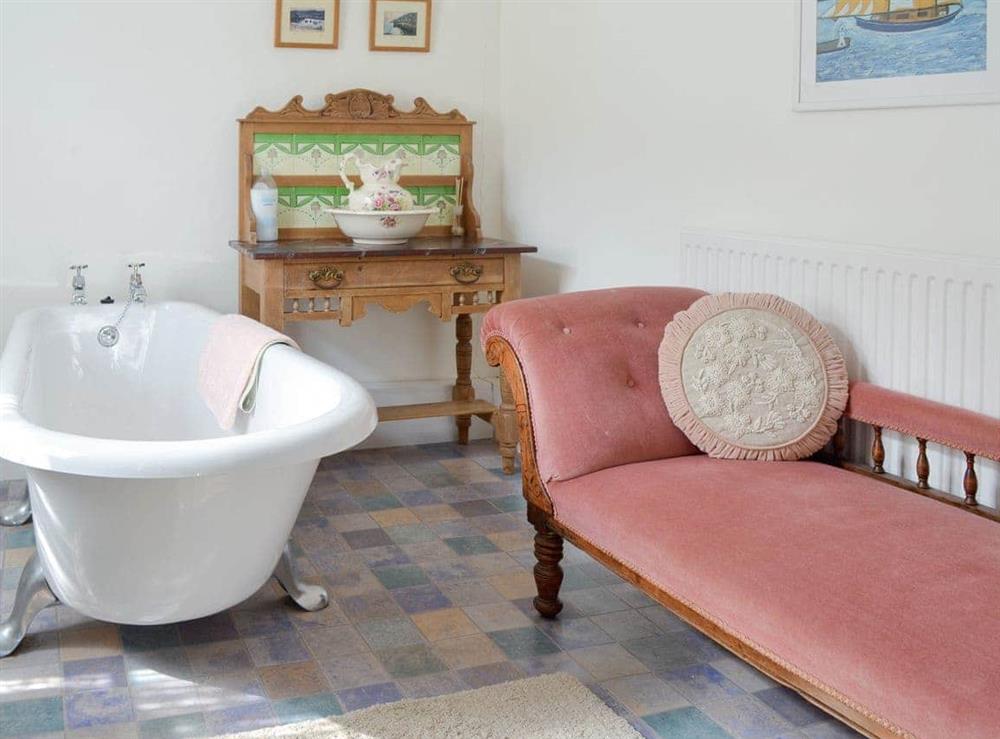 Free-standing bath within bathroom at Pen Camneves in Newlyn, near Penzance, Cornwall