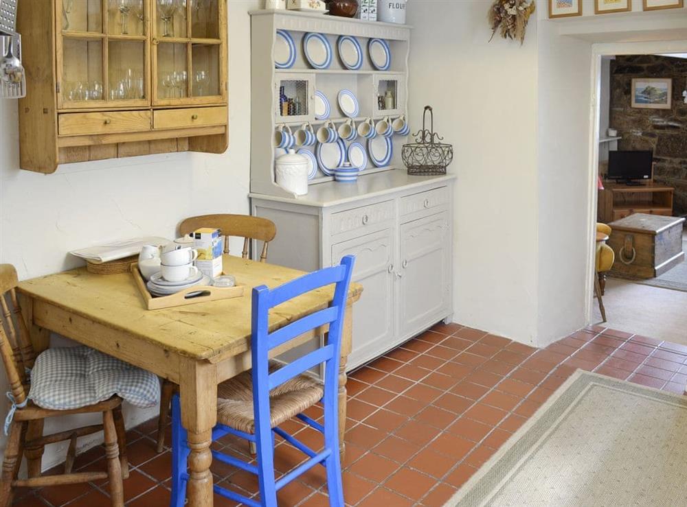Intimate dining area within the kitchen at Pen Camneves in Newlyn, near Penzance, Cornwall