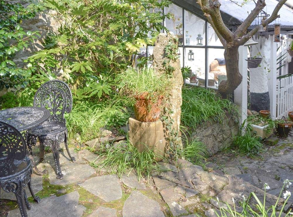 Mature garden with outdoor furniture at Pen Camneves in Newlyn, near Penzance, Cornwall