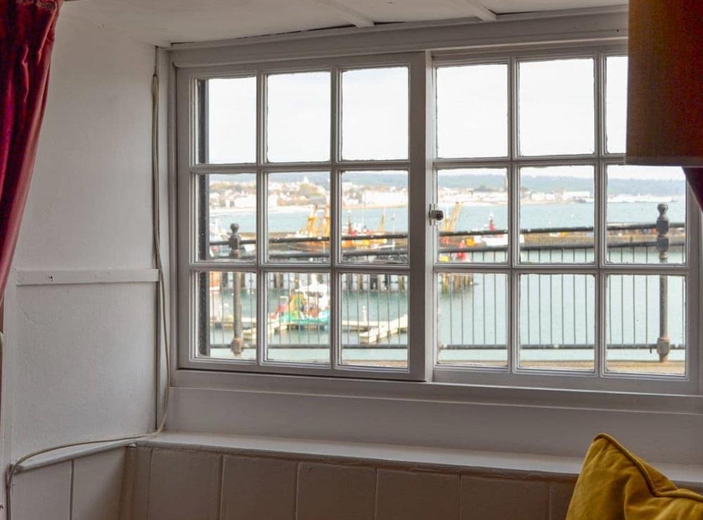 Views over the harbour from the living room at Pen Camneves in Newlyn, near Penzance, Cornwall