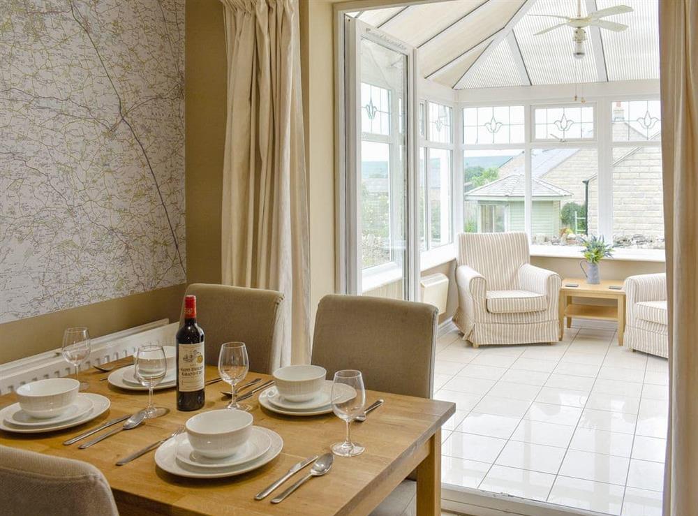 Dining area with access to conservatory at Pen Hill View in Leyburn, near Northallerton, North Yorkshire
