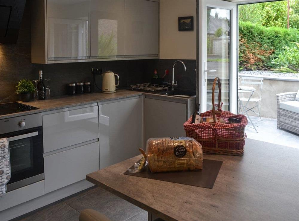 Modern, well equipped kitchen with patio doors at Pen Parc in Bryncrug, near Tywyn, Gwynedd