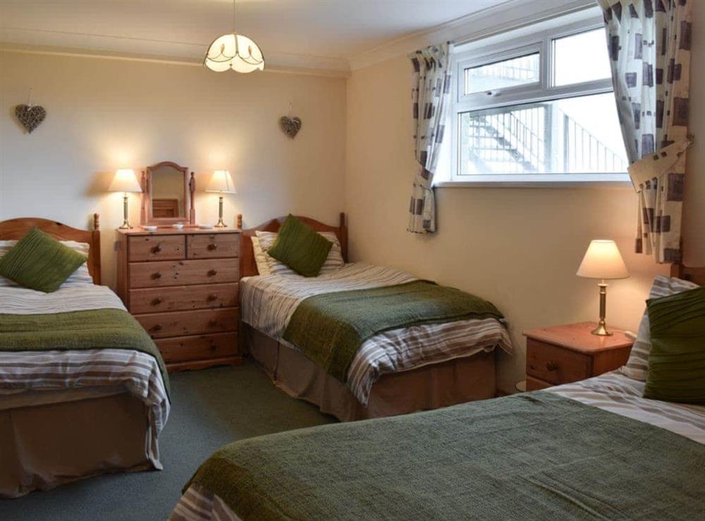 Bedroom with double & 2 single beds (photo 2) at Pen Y Bryn Apartment in Manordeilo, near Llandeilo, Dyfed