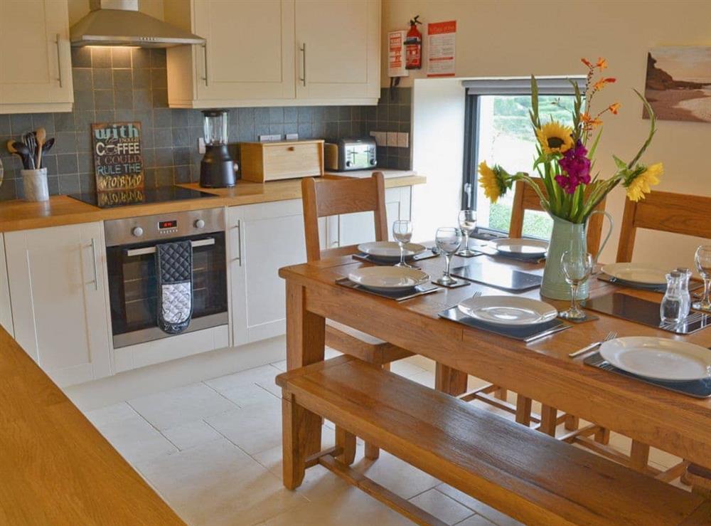 Open plan living/dining room/kitchen (photo 4) at Pen Yr Allt in Llanfaelog, near Rhosneigr, Gwynedd