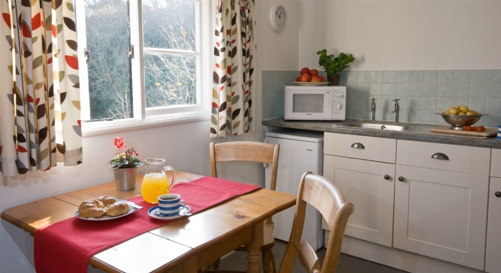 The kitchen and dining area at Penarvon Cabin in Helston, Cornwall
