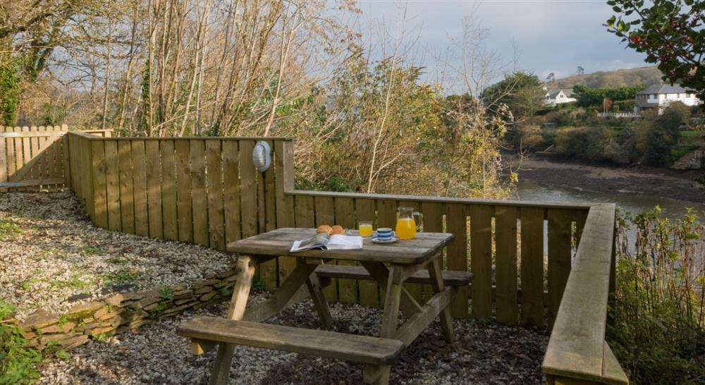 The outdoor seating area at Penarvon Cabin in Helston, Cornwall