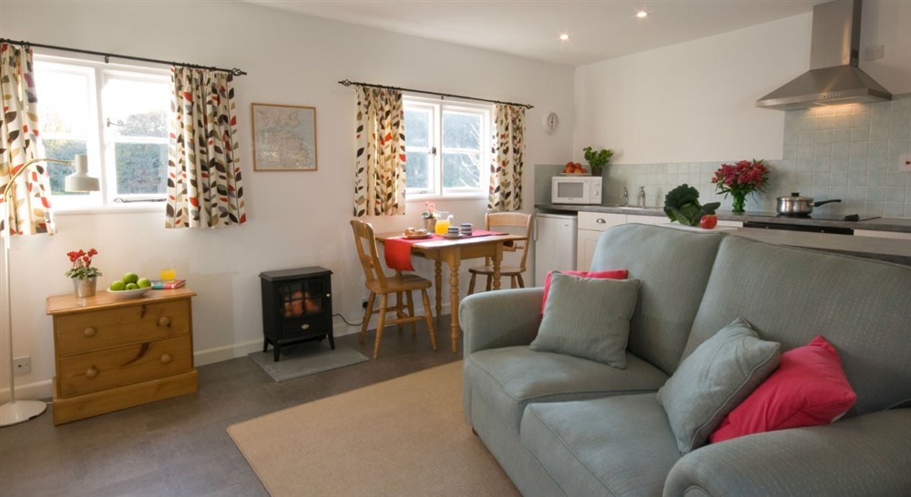 The sitting and dining area (photo 2) at Penarvon Cabin in Helston, Cornwall