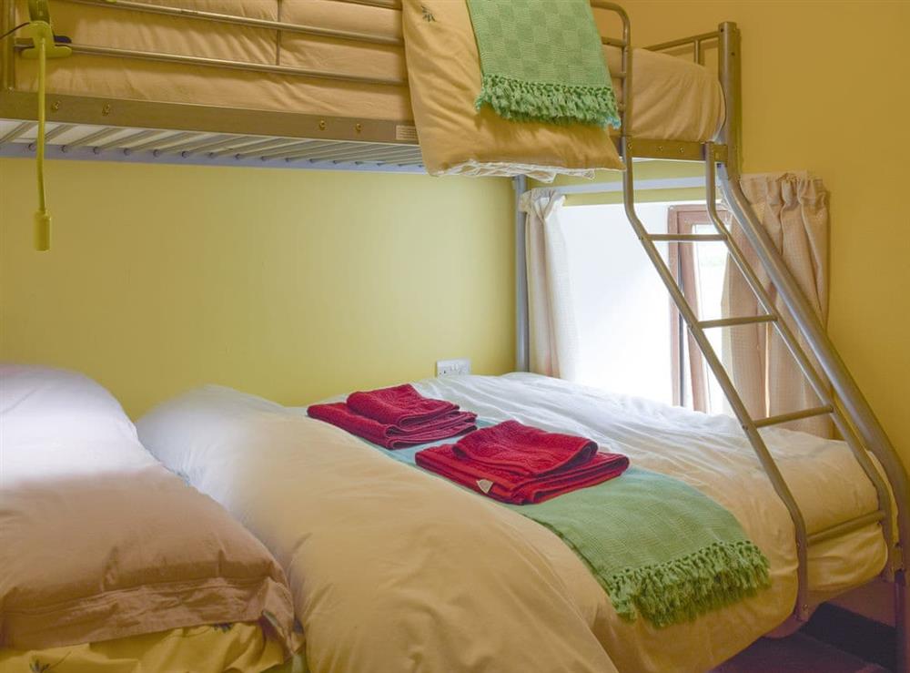 Cheerfully decorated bunk bedroom at Mill Cottage, 