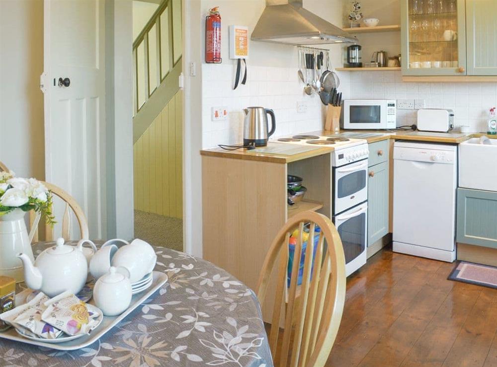 Charming kitchen/ dining room (photo 2) at Pendragon Cottage in Tregatta, near Tintagel, Cornwall