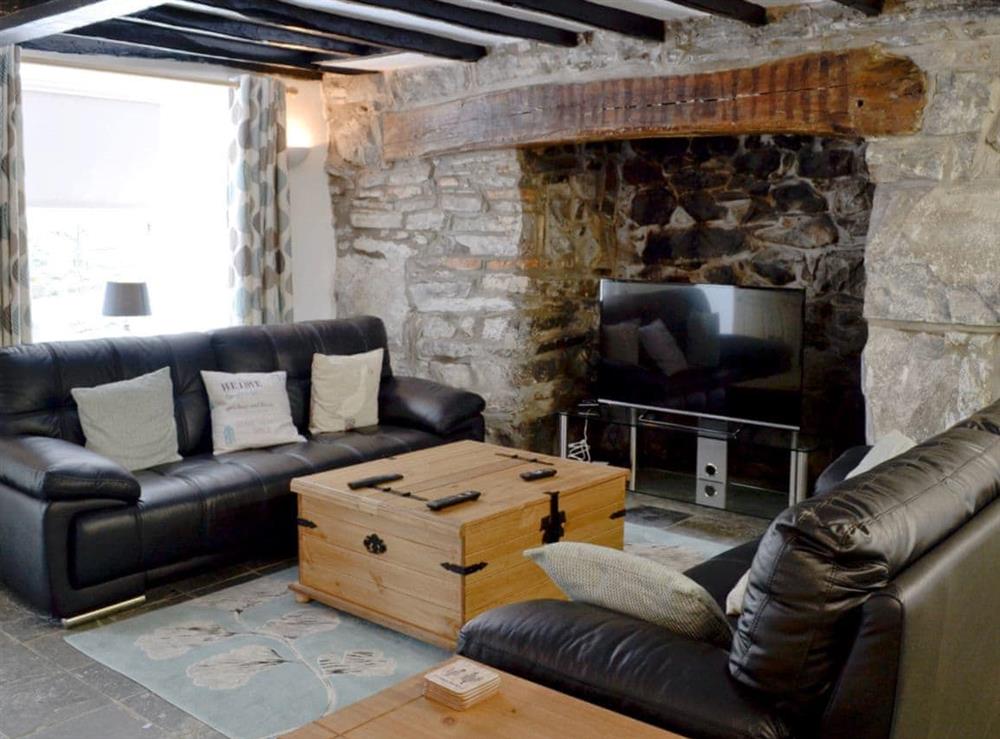 Large living room/ kitchen, beamed ceiling at Pendref in Trawsfynydd, near Blaenau Ffestiniog, Gwynedd