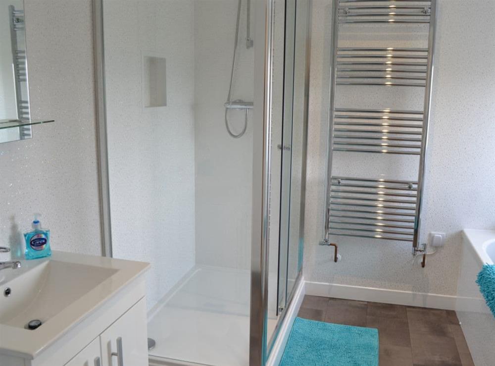 Bathroom with separate shower at Penfose Apartment in Mevagissey, Cornwall