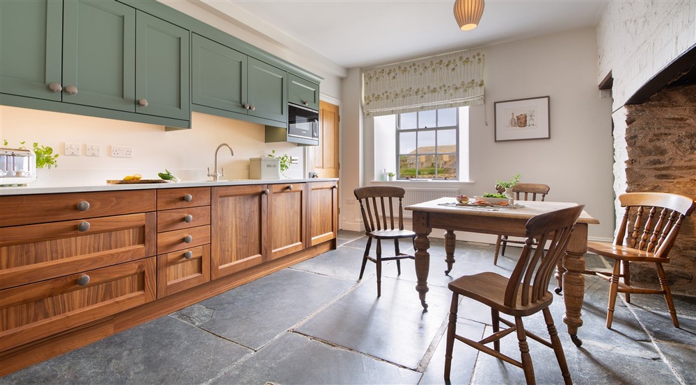 The table for four in the kitchen at Pengirt in Polzeath, Cornwall