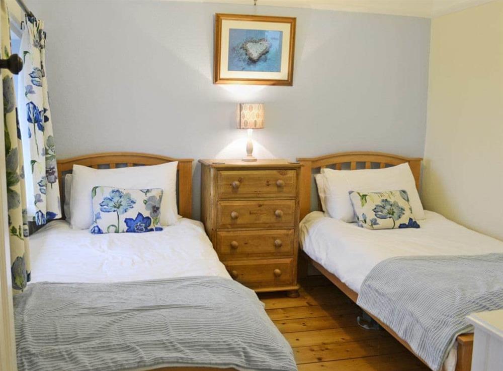 Comfortable twin bedroom at Penhill Farm Cottage in Fremington, near Barnstaple, Devon