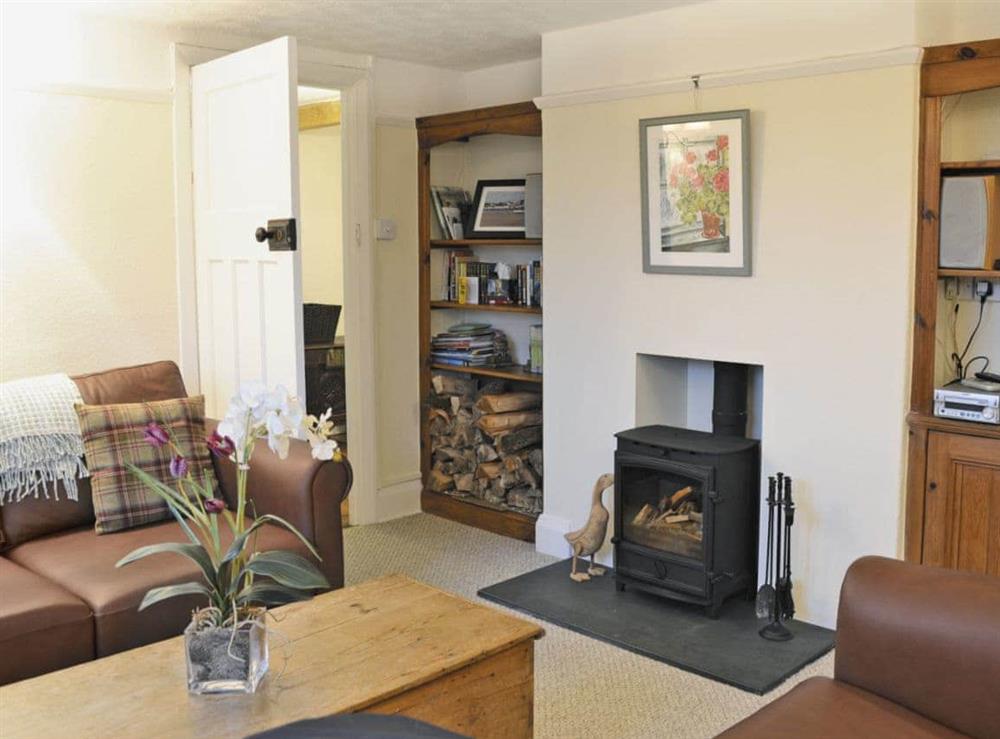 Tastefully furnished living room with wood burner (photo 2) at Penhill Farm Cottage in Fremington, near Barnstaple, Devon