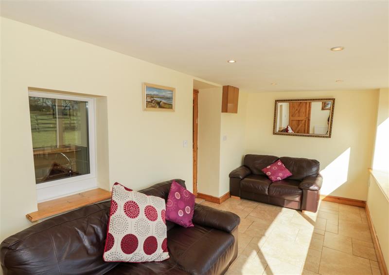 Relax in the living area at Penllyn, Newborough