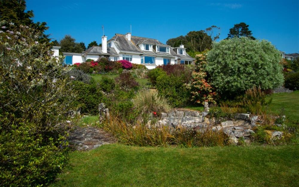 A lovely view of the house taken from the descending garden. at Penmorva in Helford Passage