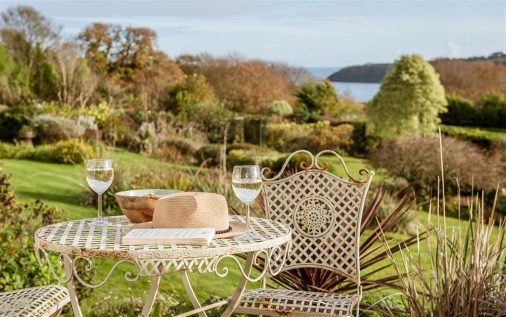 Admire the view with a glass of wine on the terrace. at Penmorva in Helford Passage