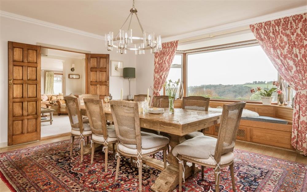 Penmorva has a stunning dining room with super views of the garden and the Helford River. at Penmorva in Helford Passage