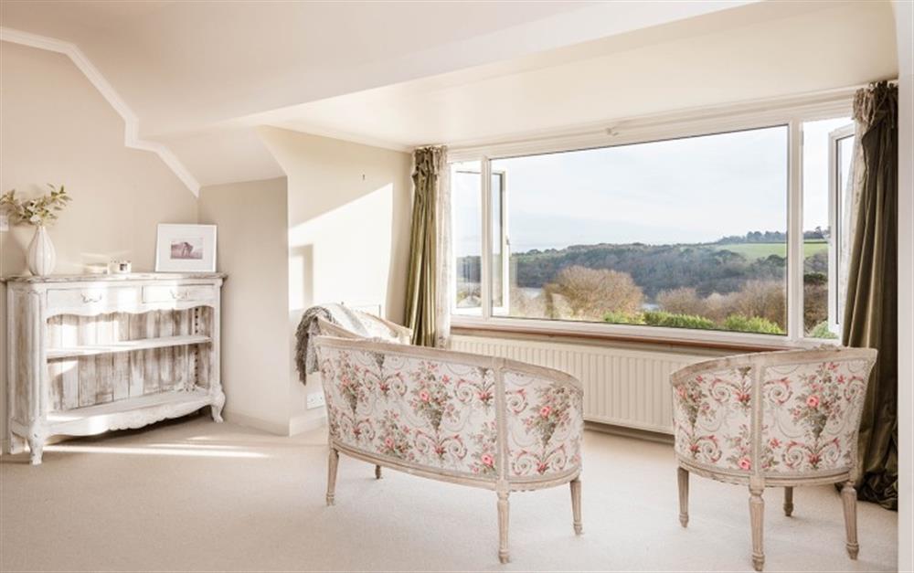 Seating in the master bedroom, overlooking the river. at Penmorva in Helford Passage