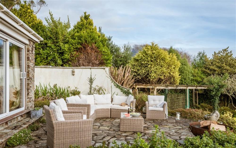 You'll love the outside seating area; it's an ideal spot for relaxing in the sun. at Penmorva in Helford Passage
