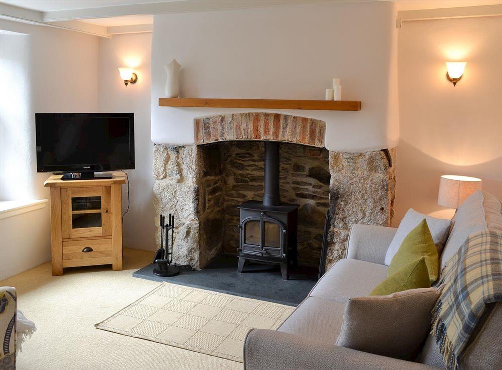 Lounge with wood burning stove (photo 2) at Penney Cottage  in Biscovey, near St Austell, Cornwall