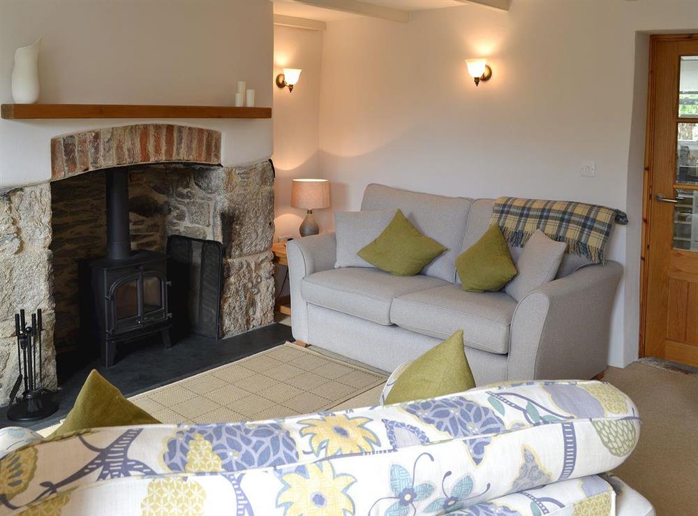 Lounge with wood burning stove at Penney Cottage  in Biscovey, near St Austell, Cornwall