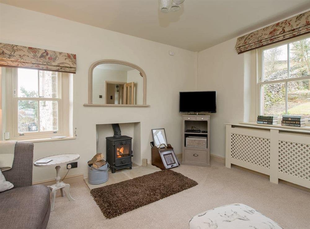 Cosy living room with woodburner at Penny Cottage in Bonsall, near Matlock, Derbyshire