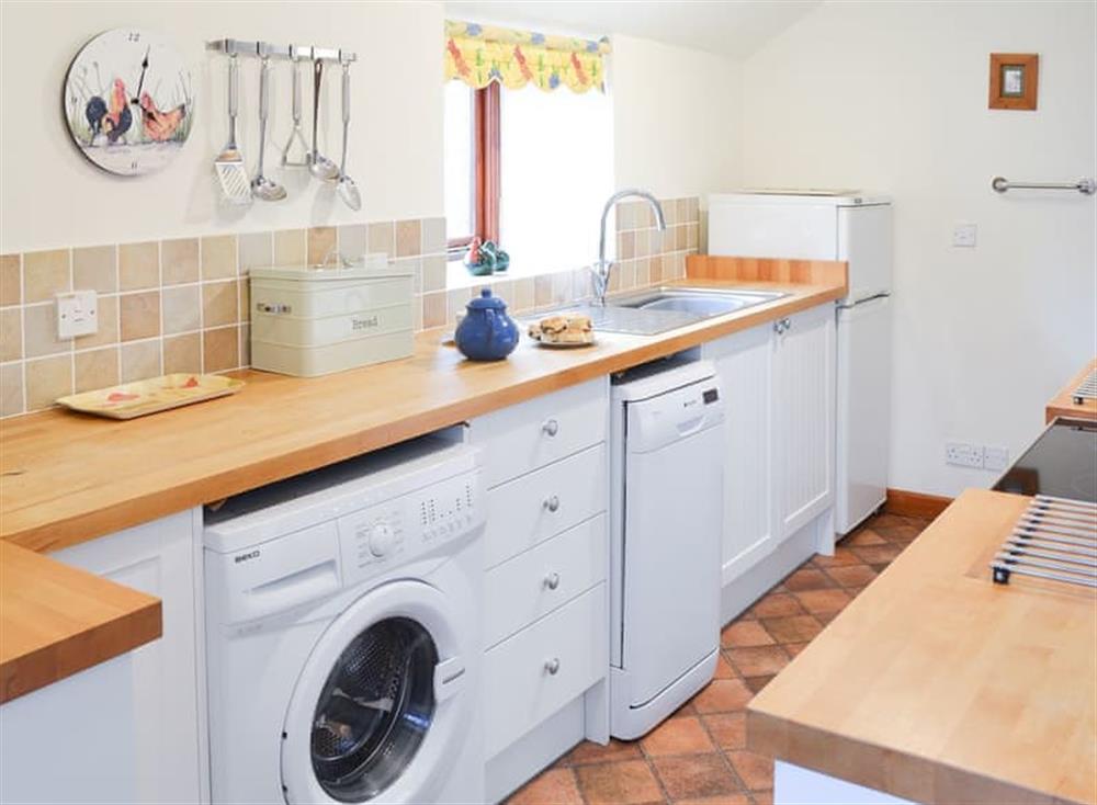 Kitchen with laundry facilities at Penny Farthing in Trewellard, near Penzance, Cornwall