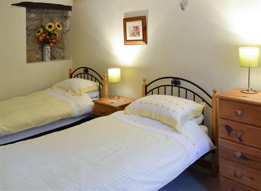 Pretty twin bedroom at Penny Farthing in Trewellard, near Penzance, Cornwall