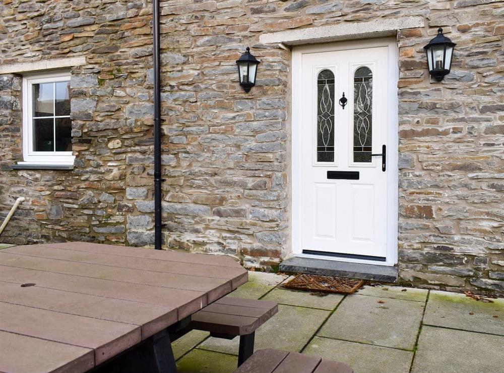 Enclosed front courtyard with garden furniture at Penrhiw, 