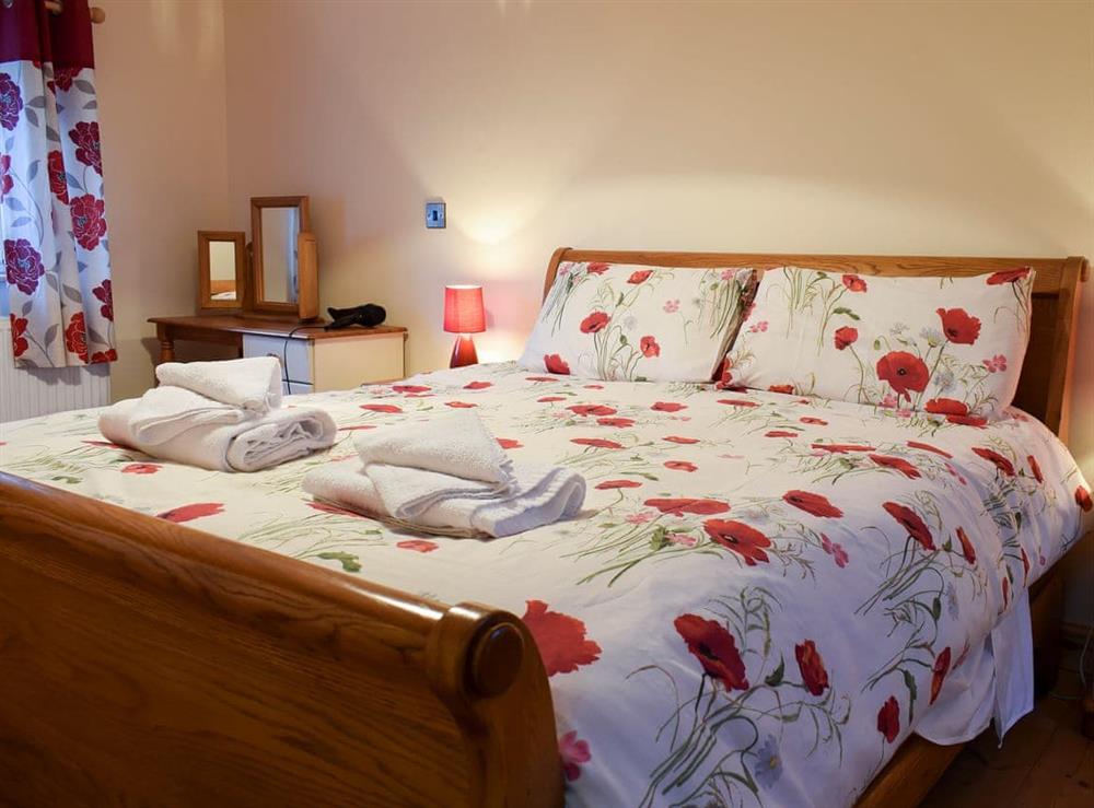 Relaxing bedroom with kingsize bed and en-suite at Penrhiw, 