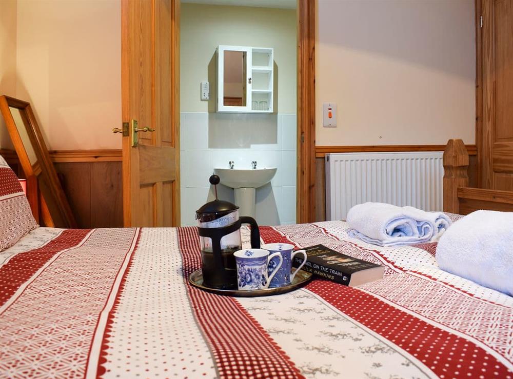 Comfortable double bedroom with en-suite (photo 2) at Ty Bach Twt, 