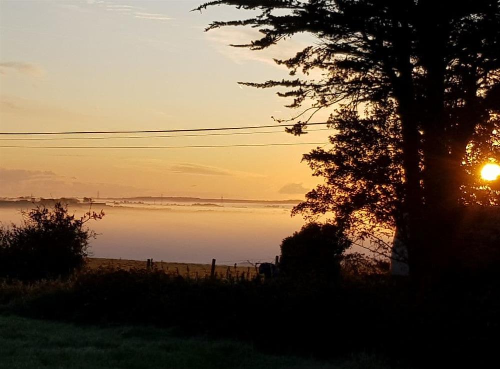 Misty morning view from the garden at Penrhos Bach in Carmel, near Llangefni, Anglesey, Gwynedd