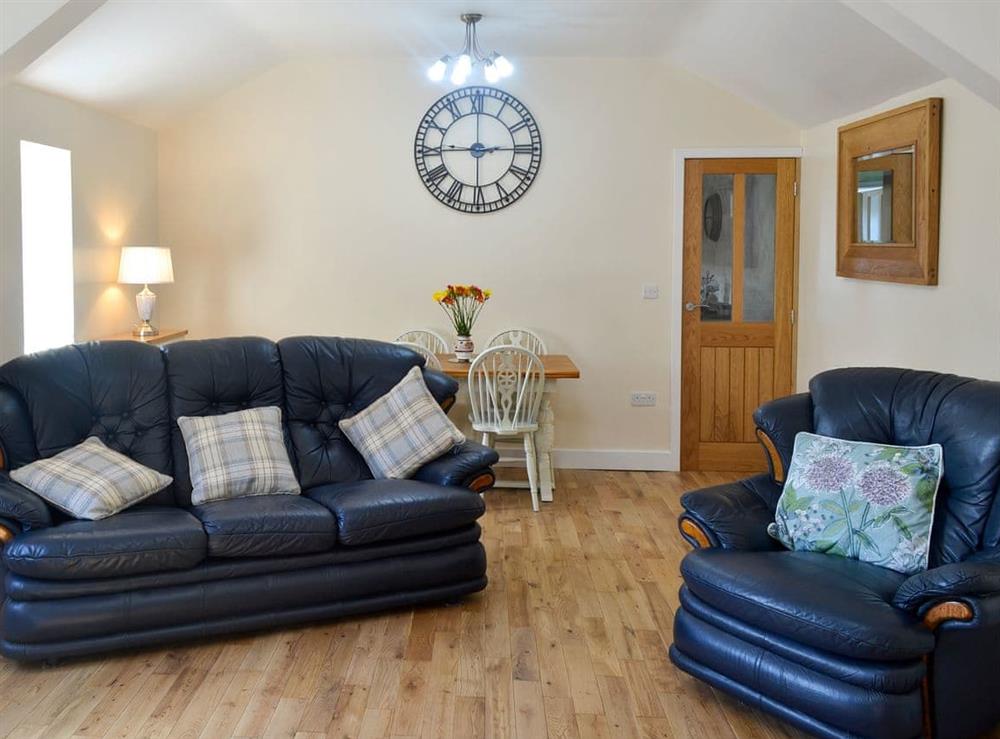 Spacious living/dining room at Penrhos Bach in Carmel, near Llangefni, Anglesey, Gwynedd