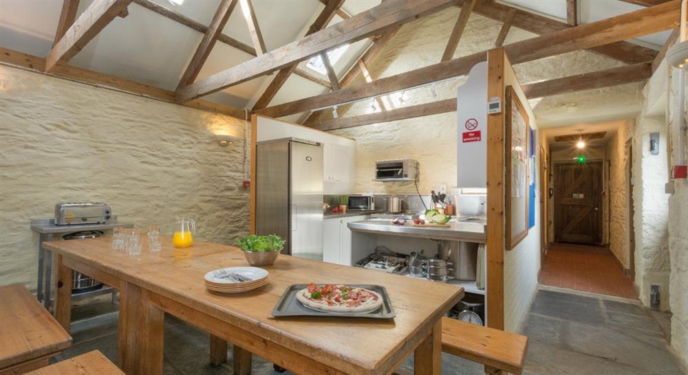 The kitchen and dining area at Penrose Bunkhouse in Helston, Cornwall