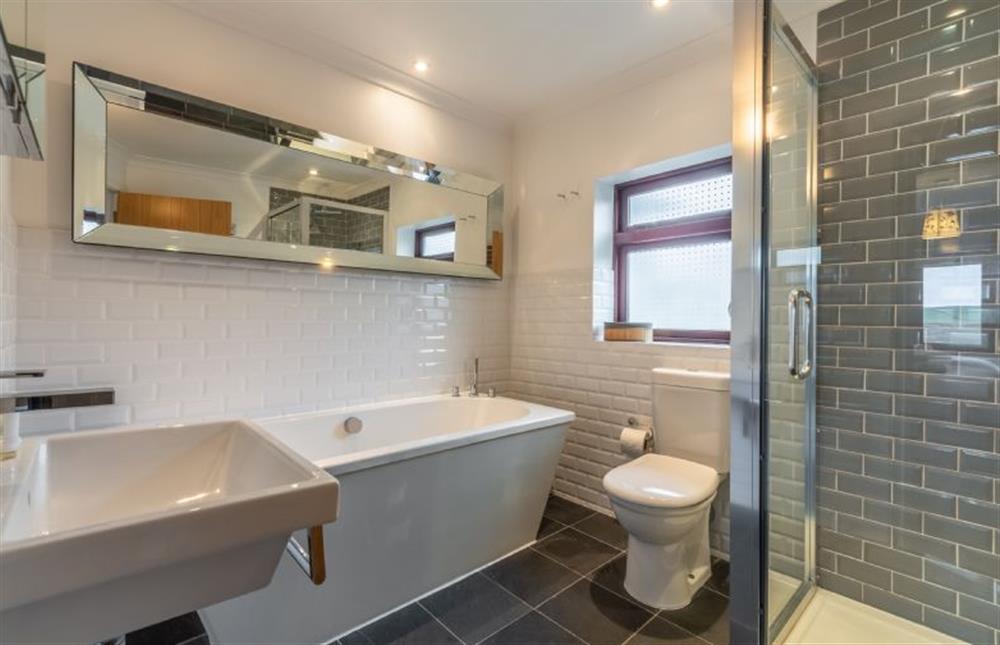 Pentewan, Cornwall: Family bathroom with bath and walk-in shower at Pentewan, Polzeath