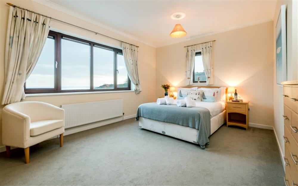 The master bedroom is at the front of the apartment with fantastic sea views. at Penthouse in Maenporth